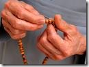 prayer beads in hand